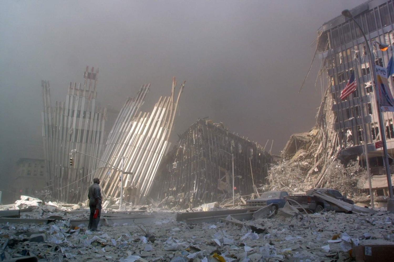 A man calls out asking if anyone needs help after the collapse of the first World Trade Centre tower, New York City, 11 September 2001 (Doug Kanter/AFP via Getty Images)